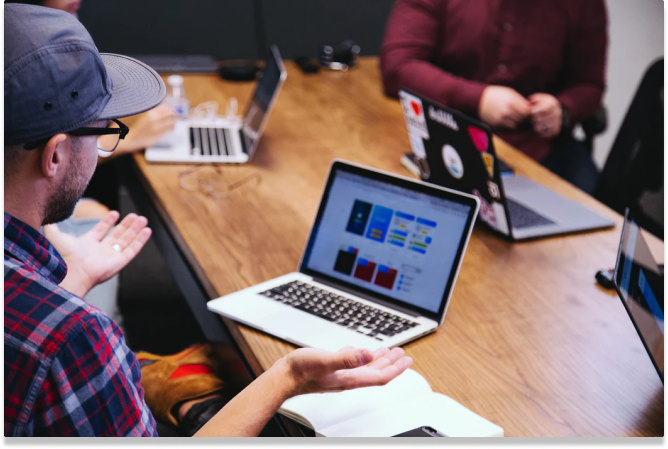 man working desk laptop